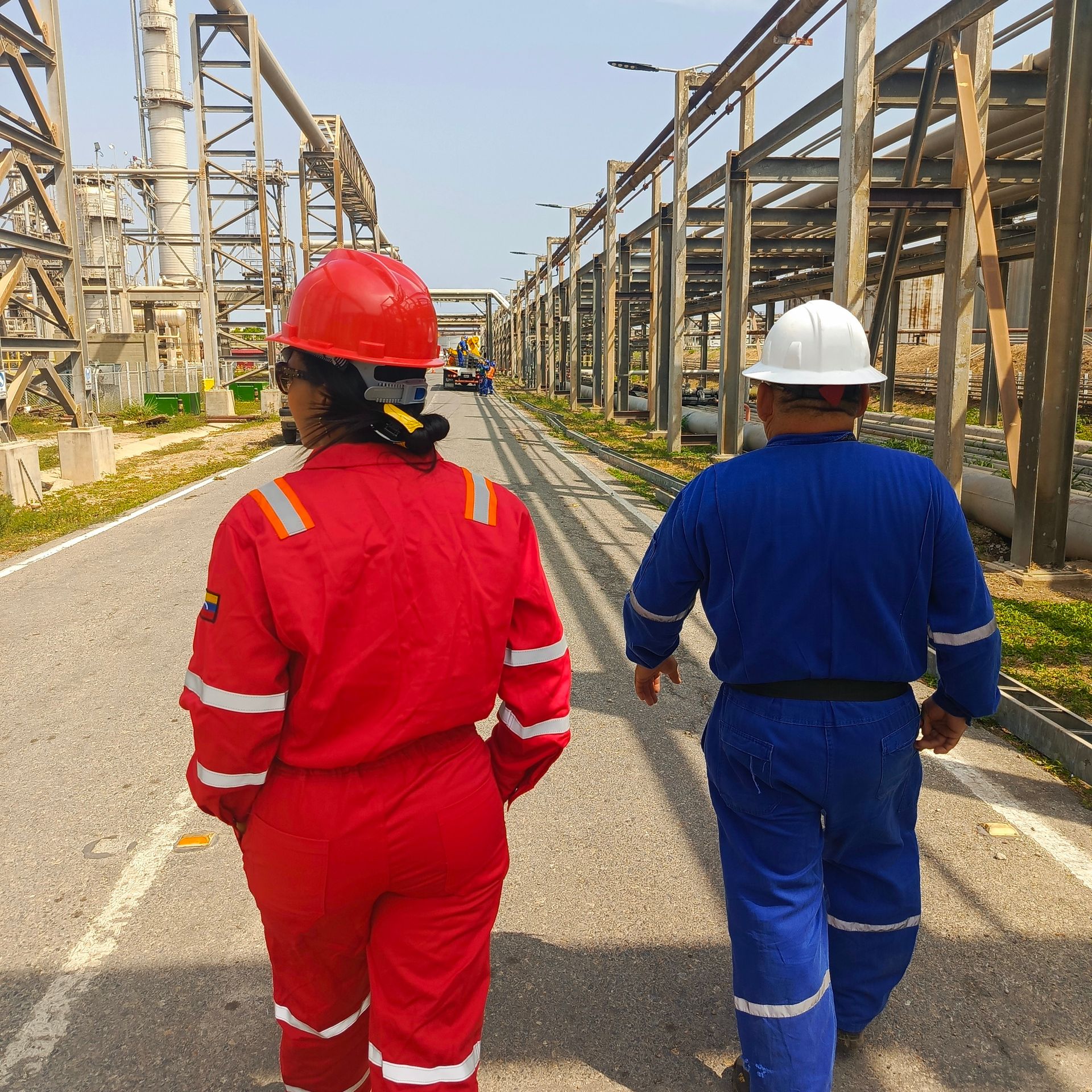 Engineer in PPE reviewing site paperwork on a checklist before work proceeds